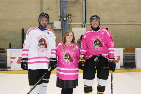 Rosie's parents (middle and right) at the match