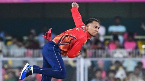Rahul Chahar delivers a ball during the Indian Premier League (IPL) T20 cricket match between Rajasthan Royals and Punjab Kings 