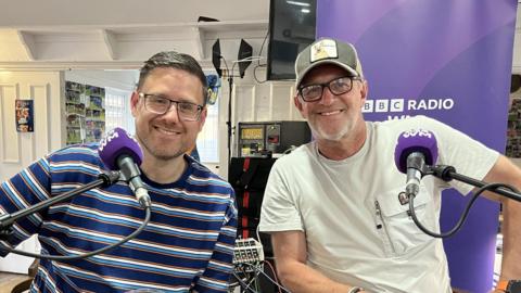 BBC Radio WM's Steve Hermon (left) and former West Bromwich Albion midfielder Richard Sneekes posing for a photo at BBC Radio WM's fan forum in Halesowen Town's Yeltz Bar on Thursday