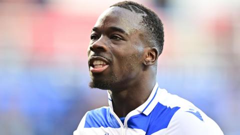 Amadou Mbengue celebrates a victory for Reading over Northampton Town