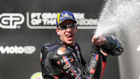 Marco Bezzecchi celebrates winning the opening race of the MotoGP season in Tokyo