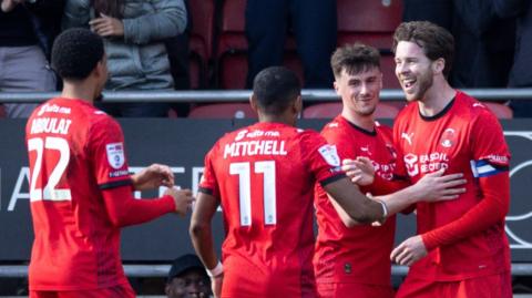 Leyton Orient players celebrate Jack Simpson's goal in the 2-1 win over Peterborough