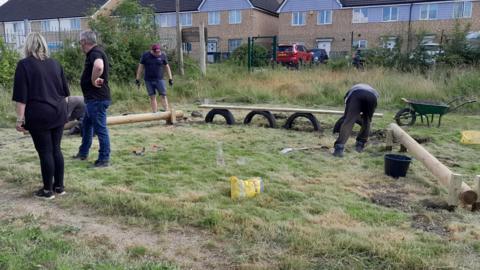 Volunteers setting up a play area