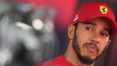 Lewis Hamilton pictured at the Belgian Grand Prix wearing a Ferrari cap