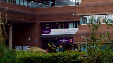 Exterior of Wolverhampton's council house, with a cost of living banner hanging from the window