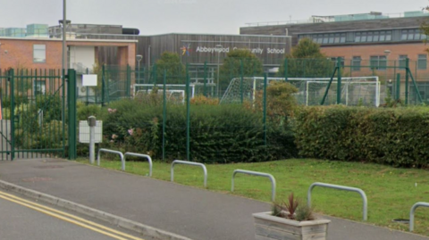 An image of Abbeywood Community School from a road outside. 