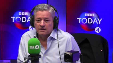 Ted Sarandos in the Radio 4 Today programme studio wearing headphones, in front of a microphone