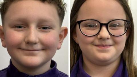 A boy with curly brown hair and a girl with long brown hair and black-rimmed glasses. Both are wearing purple tops.