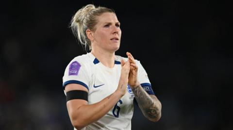 Millie Bright applauds supporters