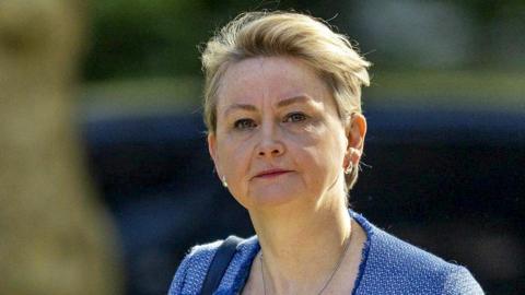 Yvette Cooper walks up Downing Street in a blue suit