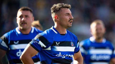 Bernard van der Linde standing with his hands on his hips during a match for Bath