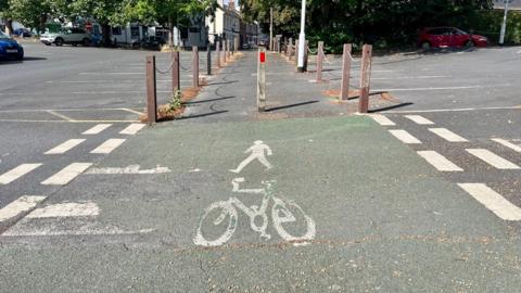 An imag showing a pedestrian and a bicycle to show a shared use path in Newtown, Exeter