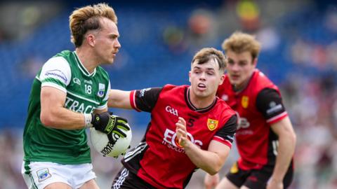 Ultan Kelm in action with Callum Rogers