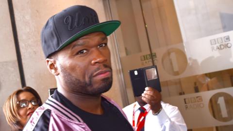 50 Cent is wearing a baseball cap