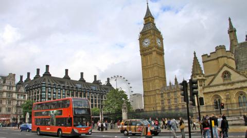 a general shot of Parliament Square, showing Big Ben, crowds and a London bus (not taken on the day of the incident)