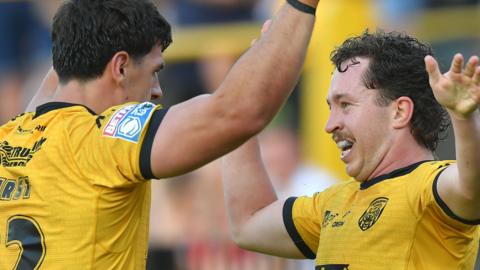 George Hirst and Tom Weaver (right) celebrate the latter's try against Toulouse