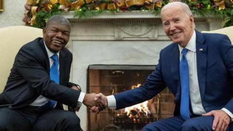 US President Joe Biden shakes hands with Angolan President Joao Lourenco during a meeting in the Oval Office of the White House in Washington, DC, on 30 November 2023