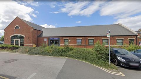 The Lagan Surgery. It is a red-brick building with a grey roof.