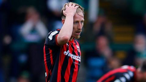 Truro City player looks dejected