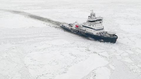 A Polaris class icebreaker designed by Finnish firm Aker Arctic Technology cuts its way through ice covered water