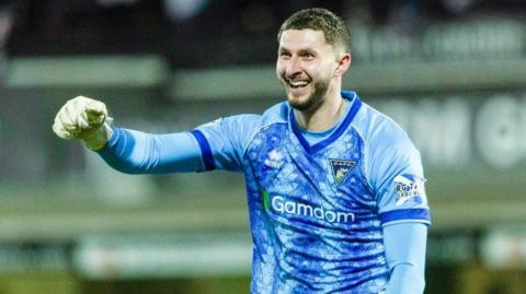 Motherwell goalkeeper Aston Oxborough celebrates with Dunfermline Athletic