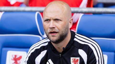 James Rowberry in the Wales dugout