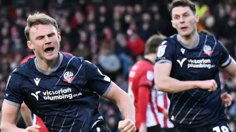 Sam Dalby, of Bolton Wanderers, celebrates after scoring 
