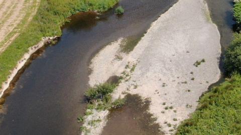 An aerial shot of the river seven, showing dried up parts of the embankment