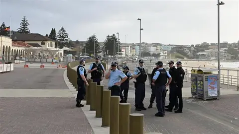 Police attend the promenade at Bondi beach