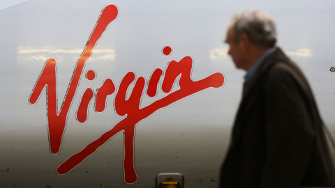 Man walks past Virgin train