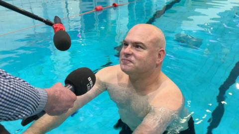 James Deighton in a swimming pool