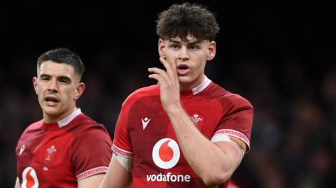 Eddie James in action for Wales with Joe Hawkins in the background