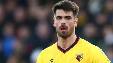 João Ferreira in his yellow Watford shirt in action during a game
