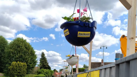 Hard hats with flowers in them