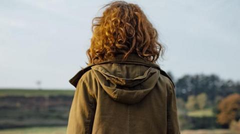 Young woman looking into distance