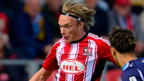 Winger Ilmari Niskanen in action for Exeter City.