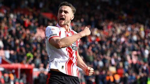 Southampton defender Taylor Harwood-Bellis punches the air in celebration