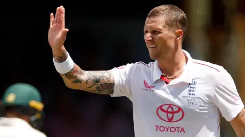 England fast bowler Brydon Carse celebrates taking a wicket