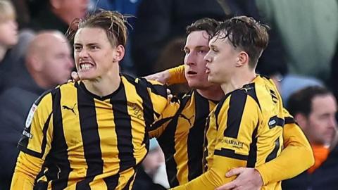 Port Vale's Ben Waine (left) celebrates scoring his side's equaliser against Luton Town with team-mates