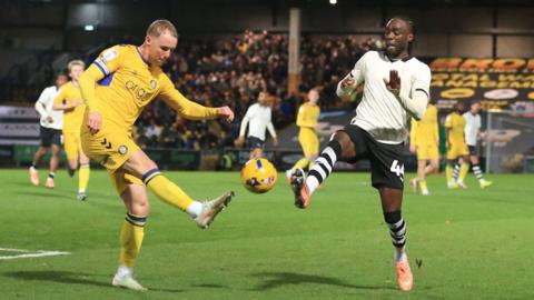Jack Grimmer and Devante Cole contest a bouncing ball