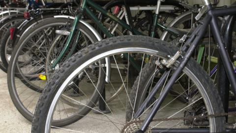 A generic image of a cycle rack. There is a number of bikes pictured in the image.