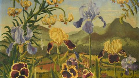 A painting shows flowers in the foreground, they are different shades of cream and purple. In the background there are large green hills and fields, seperated by rows for dark green bushes. 