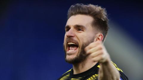 Luke Garbutt celebrates after the final whistle at Tranmere