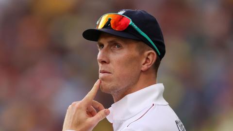 England batter Zak Crawley puts his finger on his chin while fielding