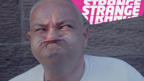 A man pulling a funny face and the strange logo