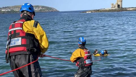 Douglas Coastguard crew rescuing children from the sea