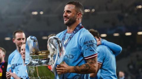 Kyle Walker holding the Champions League trophy