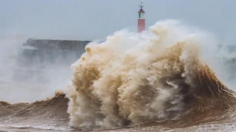 Waves crash against Watchet seafront