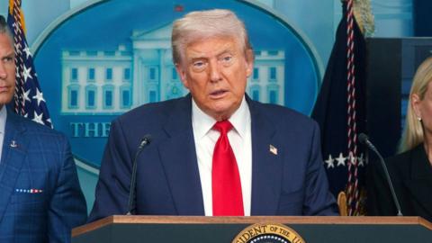 Donald Trump is talking to the press.