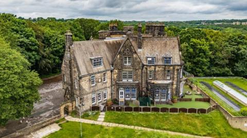 A Victorian property surrounded by lawns